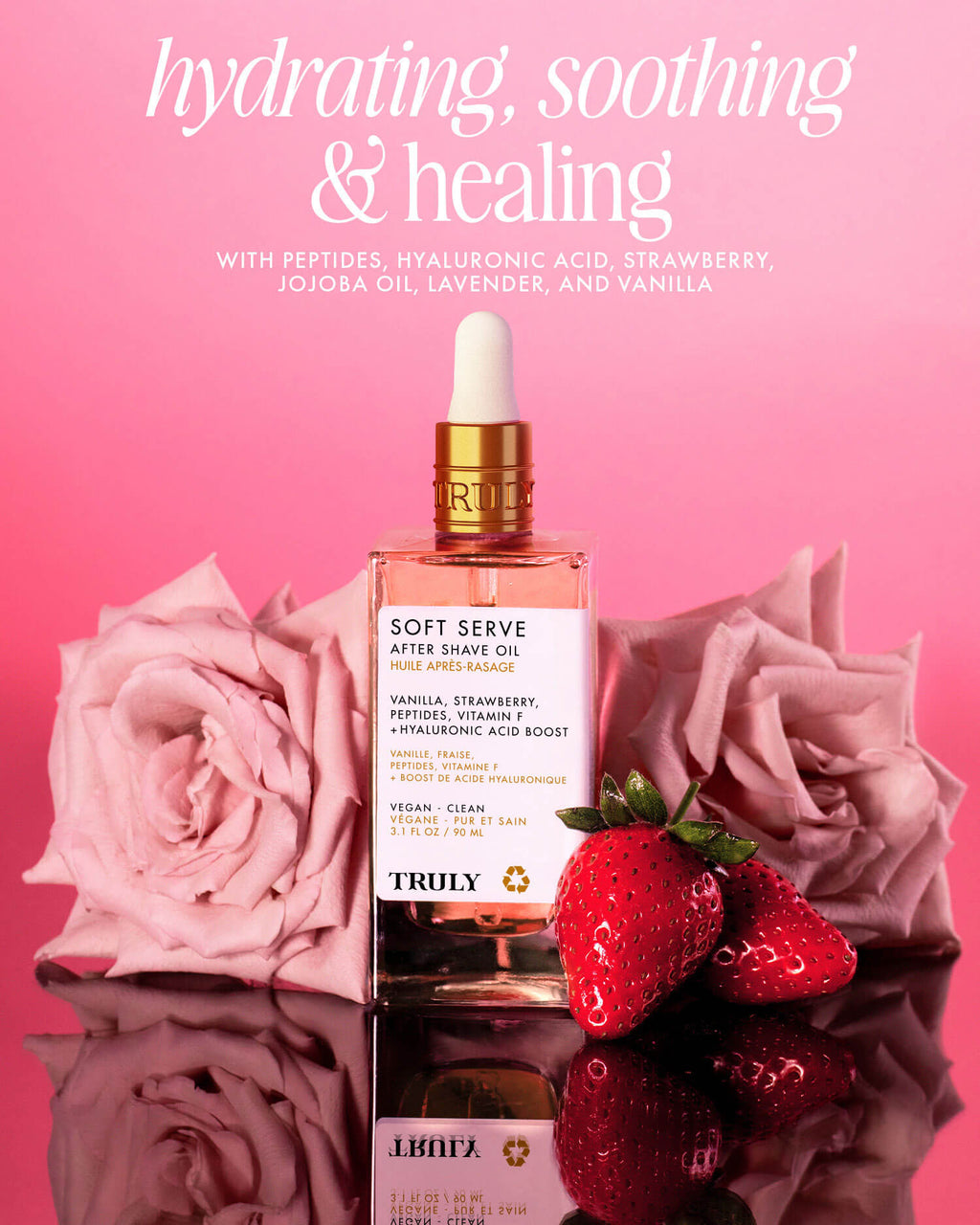 A bottle of Soft Serve After Shave Oil rests on a reflective surface, surrounded by pink roses and fresh strawberries, while text above highlights its hydrating, soothing, and healing benefits.